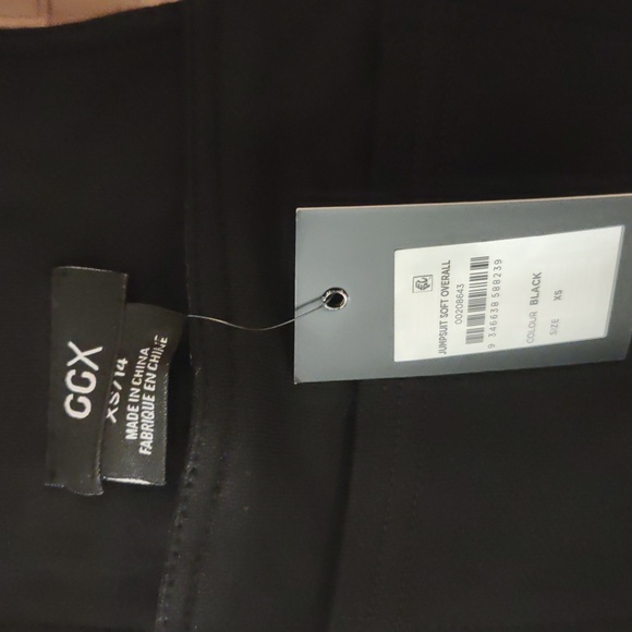 Black soft jumpsuit with back and side pockets; elastic leg bottoms - Picture 2 of 10